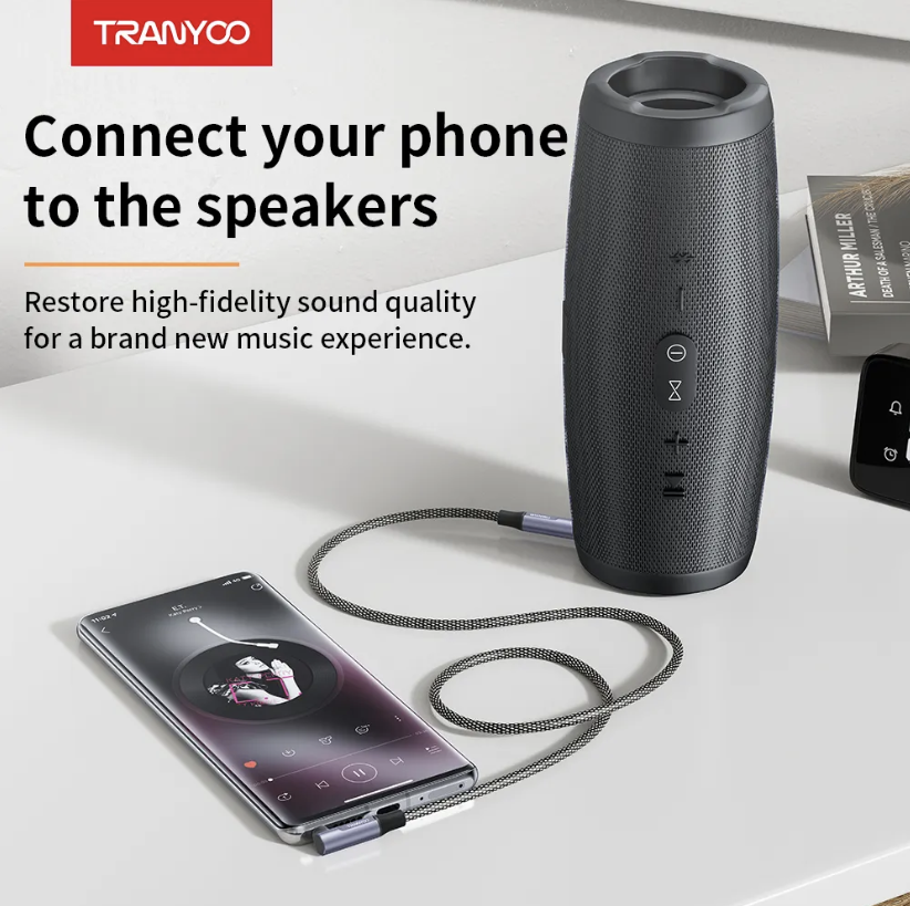 Audio 3.5 To 3.5mm Braided Cable Connected To A Speaker Side View